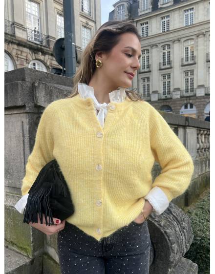 Gilet jaune en laine à boutons blancs